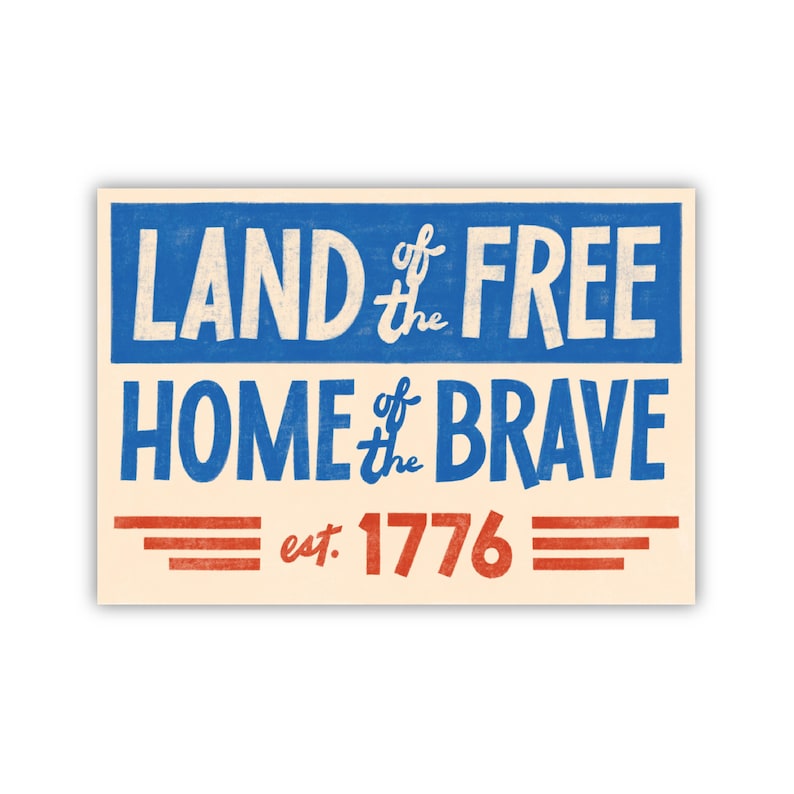 May include: A vintage-style sign with blue and red text on a cream background. The sign reads "Land of the Free Home of the Brave est. 1776".