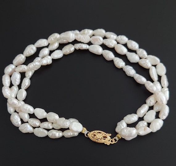 Multi strand freshwater pearl bracelet deals