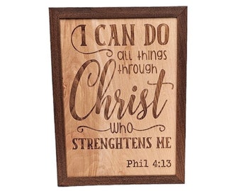 May include: Wooden sign with a brown frame and the text "I can do all things through Christ who strengthens me Phil 4:13".