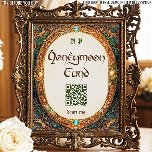 May include: An ornate, gold-colored frame with an oval-shaped center. The center displays the words "Honeymoon Fund" in elegant script, along with a QR code and the words "Scan me". The frame has intricate floral and jewel-toned details.