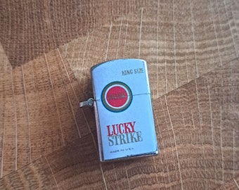 Vintage miniature Lucky Strike lighter