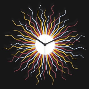 May include: A modern wall clock with a white face and black hands. The clock is surrounded by a ring of wavy lines in red, yellow, and blue.