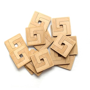 Set of elegant geometric wooden coasters made of laser cut birch plywood - Model 1.1