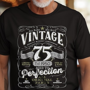 May include: Black t-shirt with a vintage-style graphic design celebrating a 75th birthday. The design features the text "Vintage" with a star and the number "75" in a circle. The text "Est 1950 Aged to Perfection" is also included, along with the phrase "All Original Parts Mostly".