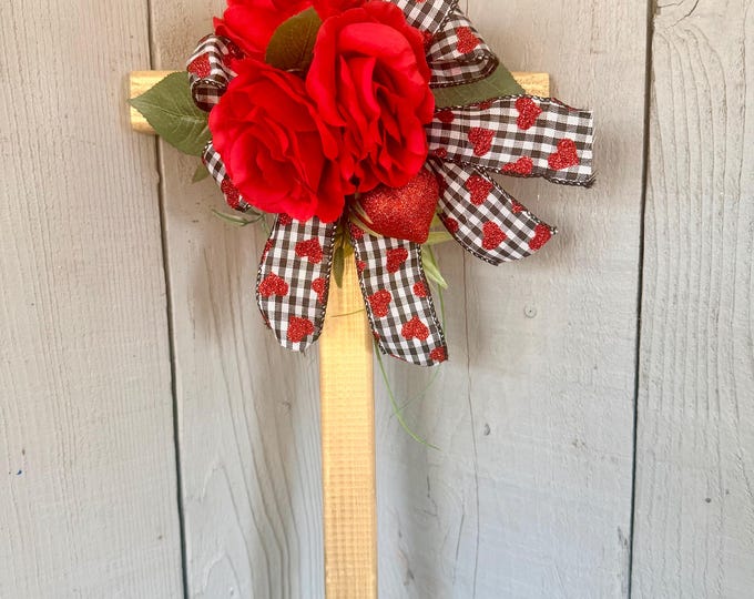 Featured listing image: Valentine cemetery, heart grave decor, red roses