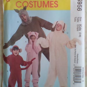 May include: A McCall's Costumes pattern packet featuring children's animal costumes. The costumes include a monkey, pig, bunny, and bear. The packet is labeled M5956 and is for kids sizes 3-8.