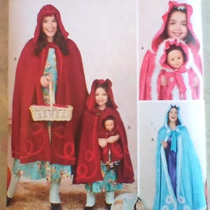 May include: Simplicity pattern 1348 A features Little Red Riding Hood and other costume designs. The image shows a woman and child in red hooded capes, and other costume variations. The pattern includes sizes 3-8/XS-XL.