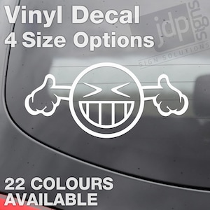 May include: White vinyl decal of a laughing emoji with thumbs up. The decal has the text "Vinyl Decal 4 Size Options" at the top and "22 COLOURS AVAILABLE" at the bottom. Designed for vehicle application.