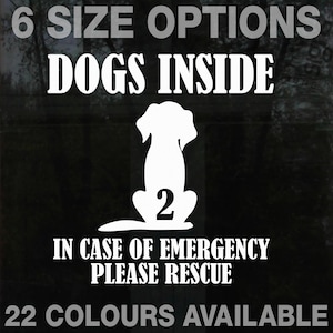 May include: White vinyl sticker with a black silhouette of a dog sitting with the number 2 on its back. The text reads "6 SIZE OPTIONS DOGS INSIDE IN CASE OF EMERGENCY PLEASE RESCUE 22 COLOURS AVAILABLE".