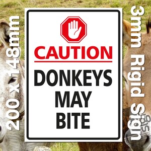 May include: White sign with black text and a red hand symbol. The sign reads "CAUTION DONKEYS MAY BITE". The sign is 200mm x 148mm and 3mm thick.