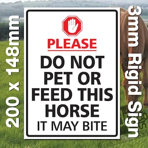 May include: White sign with red and black text that reads "PLEASE DO NOT PET OR FEED THIS HORSE IT MAY BITE". A red hand stop sign is at the top of the sign. The sign is 200mm x 148mm and is made of 3mm rigid material.