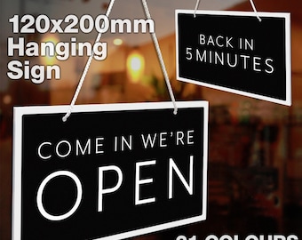 May include: Black and white hanging sign with white text that reads "Come in we're open". The sign is 120mm by 200mm and has a white frame. The reverse side of the sign reads "Back in 5 minutes". 21 colors are available.