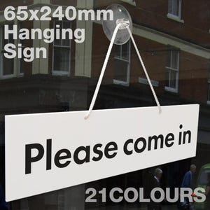 May include: White rectangular hanging sign with black text that reads "Please come in". The sign is 6.5 inches by 9.5 inches and is hanging from a clear suction cup.