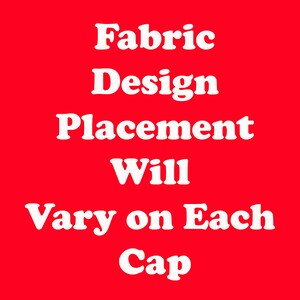 White text on a red background reads "Fabric Design Placement Will Vary on Each Cap".