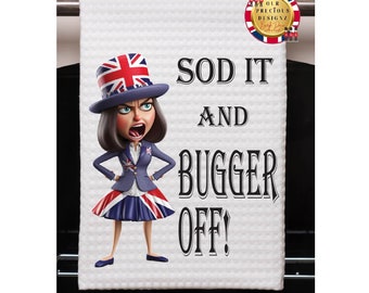 May include: White kitchen towel with a cartoon image of a woman wearing a Union Jack hat and dress. The text "Sod it and Bugger Off!" is printed on the towel.