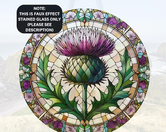 May include: A stained glass design of a thistle flower with a purple bloom and green leaves. The design is surrounded by a circular frame of smaller flowers in various colors.