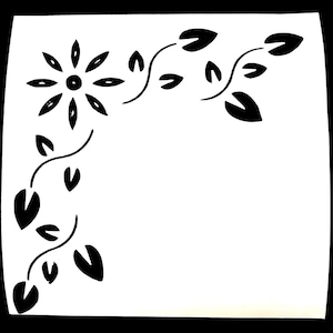 May include: Black and white floral corner design with a stylized flower and leaves.