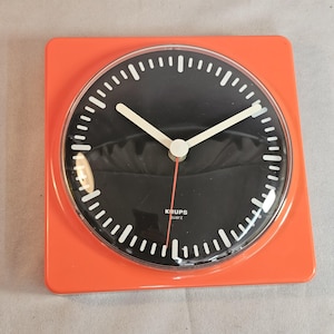 Orange Krups quartz plastic wall clock Space Age from the 70s Pop Art