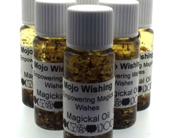 May include: Six small glass bottles filled with a clear liquid and gold glitter. Each bottle has a white label with the text "Mojo Wishing Empowering Magical Wishes Magickal Oil".