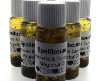 May include: Six small glass bottles with white lids filled with a clear liquid and small flecks of gold. The bottles have white labels with black text that reads "Spellbound Fascinate & Captivckal Oil Magickal Oil".