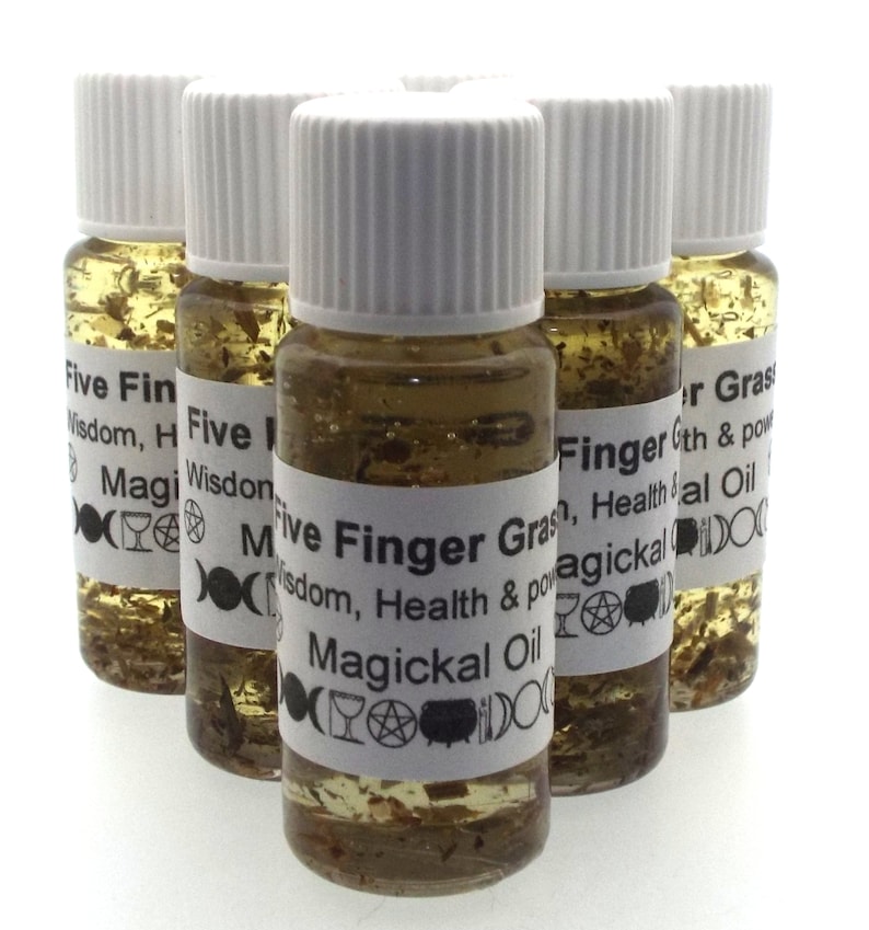 May include: Six small glass bottles with white lids filled with a clear liquid and herbs. The bottles have labels that read "Five Finger Grass, Wisdom, Health & Power, Magickal Oil".