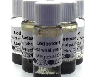 May include: Six small glass bottles with white lids and labels. The labels are white with black text that reads "Lodestone Attract what you Wish Magickal Oil".