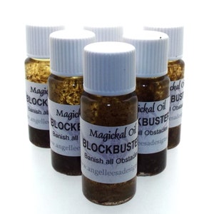 May include: Six small brown glass bottles with white lids and labels that read "Magickal Oil Blockbuster Banish all Obstacles www.angelleesadesigns".