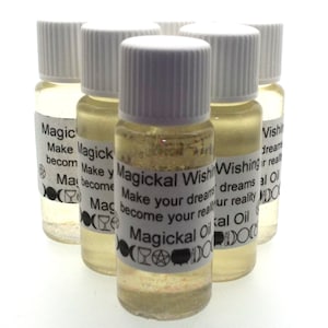 May include: Six small glass bottles with white lids and labels. The labels have a gold glitter background and text that reads "Magickal Wishing Oil Make your dreams become your reality".