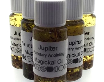 May include: Six small glass bottles with white lids filled with a clear liquid and herbs. The bottles have labels that say "Jupiter Planetary Anointing Magickal Oil" with symbols.