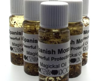 May include: Six small glass bottles filled with a clear liquid and brown flakes. The bottles have white labels with black text that reads "Spanish Moss Powerful Protection Magickal Oil".