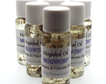 May include: Six small clear glass bottles with white lids filled with a light brown liquid and dried herbs. The bottles have labels that read "Magickal Oil Mugwort Visionary & Psychic Work angelleesa designs."