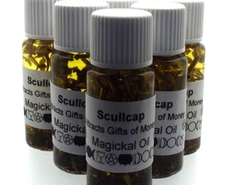 May include: Six small glass bottles filled with a clear liquid and herbs. The bottles have white labels with black text that reads "Scullcap Attracts Gifts of Money Magickal Oil".