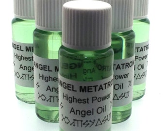 May include: Six small glass bottles with white caps filled with a green liquid. Each bottle has a white label with black text that reads "Angel Metatron Highest Power Angel Oil" and symbols.