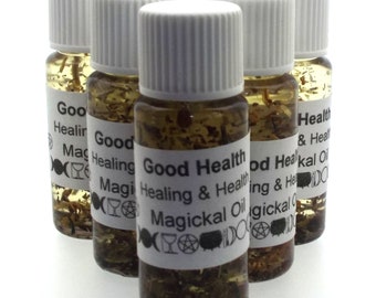 May include: Six small glass bottles with white caps filled with a clear liquid and herbs. The bottles have labels that say "Good Health Healing & Health Magickal Oil".