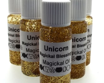 May include: Six small bottles of gold glitter oil with white labels. The labels read "Unicorn Magickal Blessing Magickal Oil".