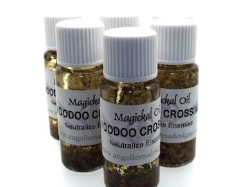 May include: Several small glass bottles filled with a golden liquid and herbs, each with a white label. The labels read "Magickal Oil Voodoo Crossing" and "Neutralize Enemies". The bottles have white caps.