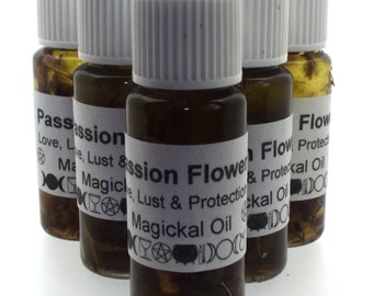 May include: Six small brown glass bottles with white lids and labels. The labels have black text and symbols. The bottles contain a dark liquid. The labels read "Passion Flower Magical Oil" and "Flower Magical Oil".