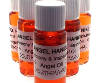 May include: Six small amber glass bottles with white screw-on caps. Each bottle has a white label with black text that reads "Angel HANIEL Harmony & Inspiration Angel Oil" and a symbol.
