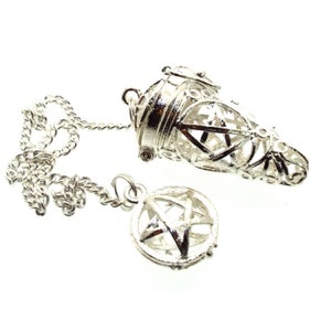 May include: A silver pendulum with a chain and a cone-shaped pendant with a pentagram design. The pendulum also has a smaller, round pendant with a pentagram design.