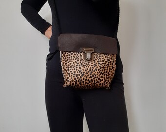 Genuine leather shoulder bag with cheetah print. A not too big shoulder bag. For your essentials like mobile phone, card, makeup, etc.