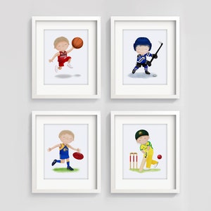 May include: Four framed illustrations of children playing different sports. The top left image shows a child in a red basketball uniform holding a basketball. The top right image shows a child in a blue hockey uniform holding a hockey stick. The bottom left image shows a child in a blue and yellow Australian rules football uniform holding a football. The bottom right image shows a child in a yellow cricket uniform holding a cricket bat.