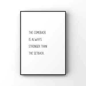 May include: A framed print with a white background and black text that reads: "THE COMEBACK IS ALWAYS STRONGER THAN THE SETBACK." The frame is black.