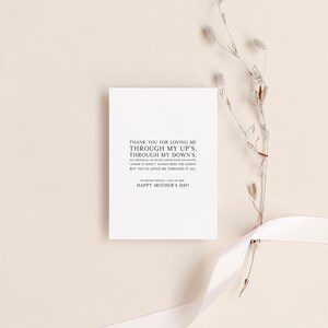 May include: A white card with a simple message of gratitude for a mother. The card reads "Thank you for loving me through my up's, through my down's. I know it hasn't always been the easiest but you've loved me through it all. I'm forever grateful. I love you Mom. Happy Mother's Day!"