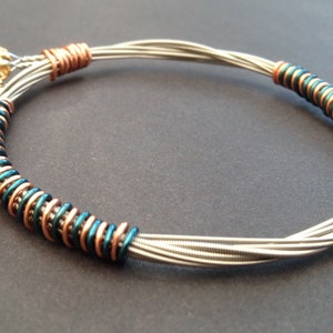 Recycled Electric Guitar String Bracelet, styled with sea green and bronze copper wire. Unisex Unique Guitarist Gift