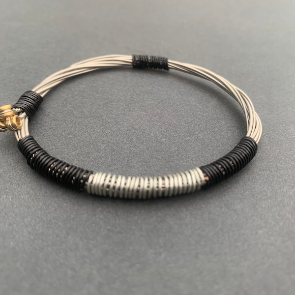 Recycled Electric Guitar String Bracelet, styled with silver and black copper wire. Unisex Unique Guitarist Gift