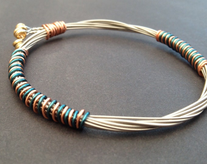 Recycled Electric Guitar String Bracelet, styled with sea green and bronze copper wire. Unisex Unique Guitarist Gift