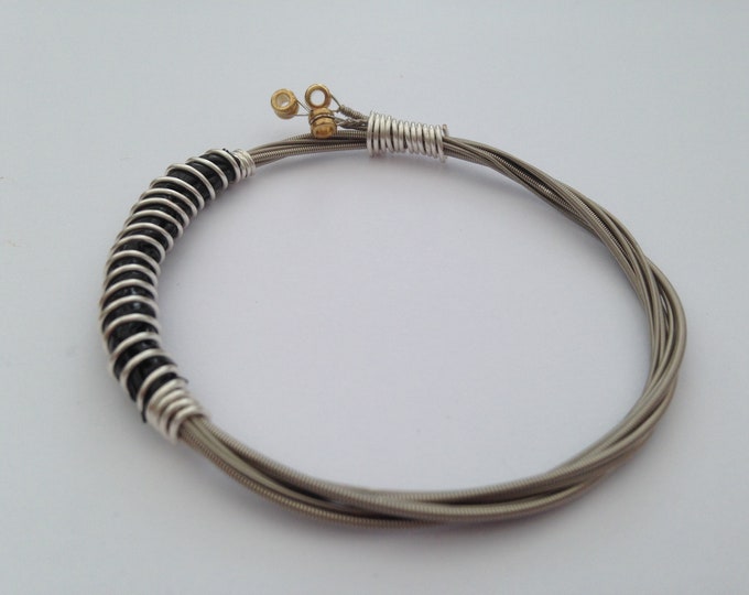 Recycled Guitar String Bracelet, styled with silver plated copper wire. Unisex Unique Guitarist Gift