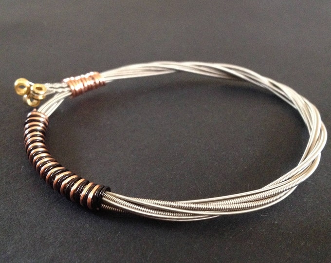Recycled Guitar String Bracelet, styled with black and bronze copper wire. Unisex Unique Guitarist Gift