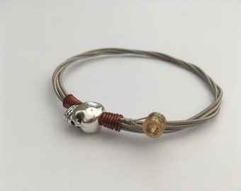 Recycled Bass Guitar String Bracelet, styled with a skull bead and copper wire. Unisex Unique Guitarist Gift