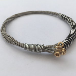 Recycled Guitar String Bracelet, styled with silver plated copper wire. Unisex Unique Guitarist Gift Six Strings